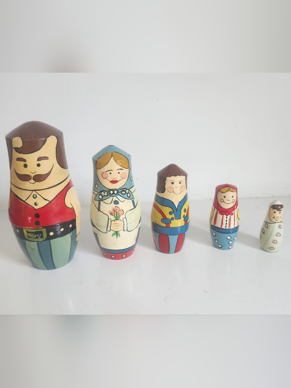 Vintage Lillian Vernon nesting dolls featuring a family of five